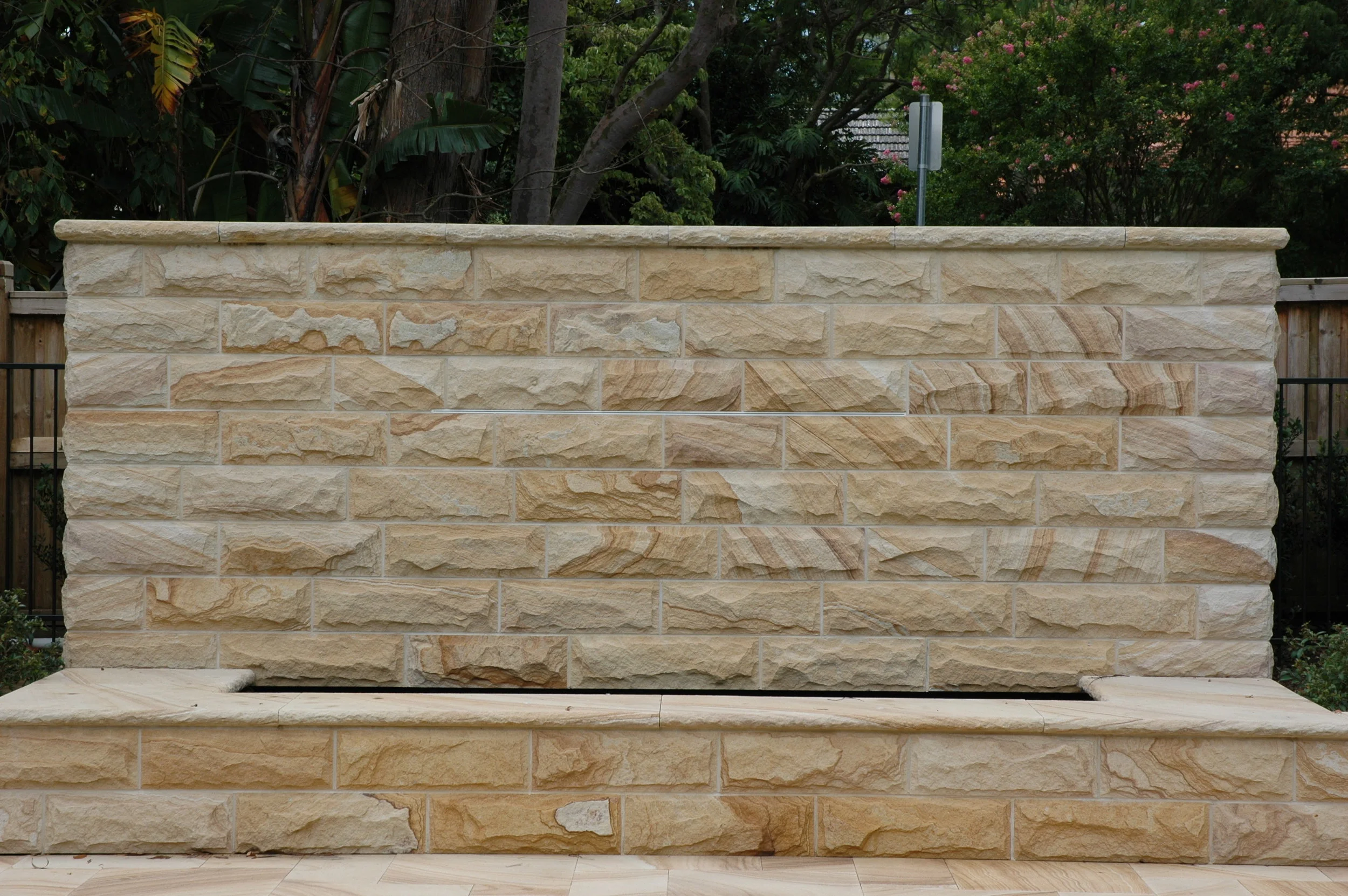 light-medium brown rockfaced cladding walling capping water feature -Artistry in sandstone.JPG