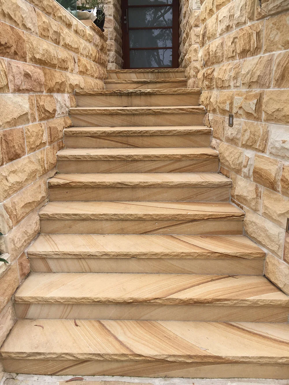 Sawn sandstone steps rock faced finish medium brown colour range