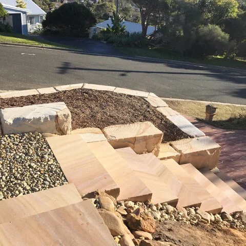 Quarry run landscaping logs and landscaping sandstone steps