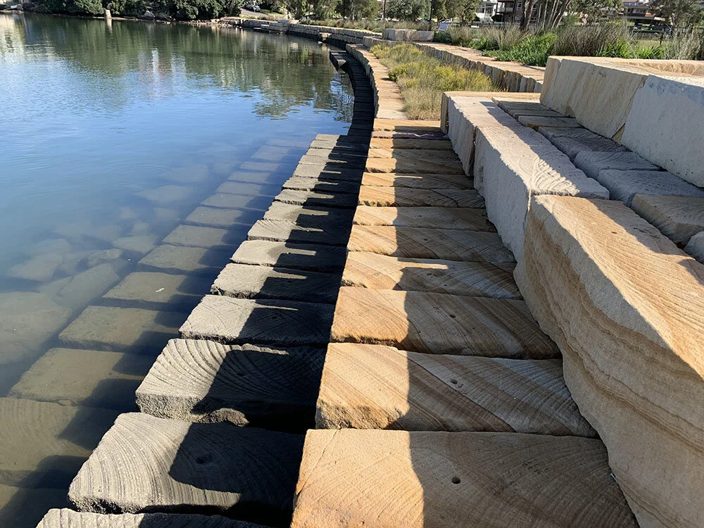 Gosford Quarries landscaping logs for seawall Morrison River Park