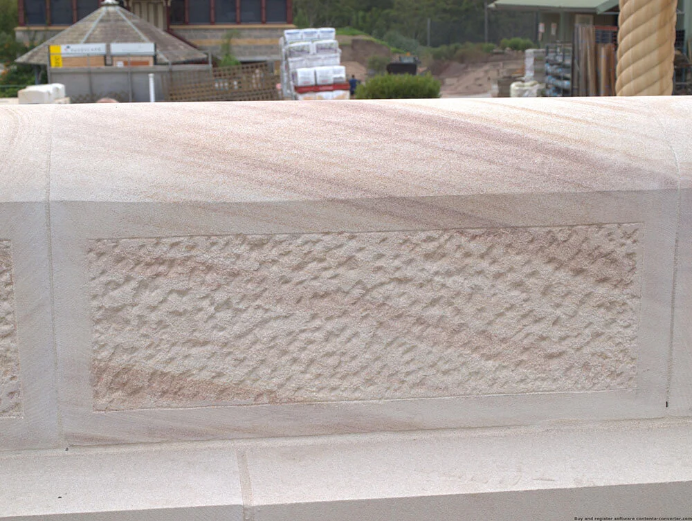 Light brown sandstone colour range bullnosed top walling with sparrow peck detail