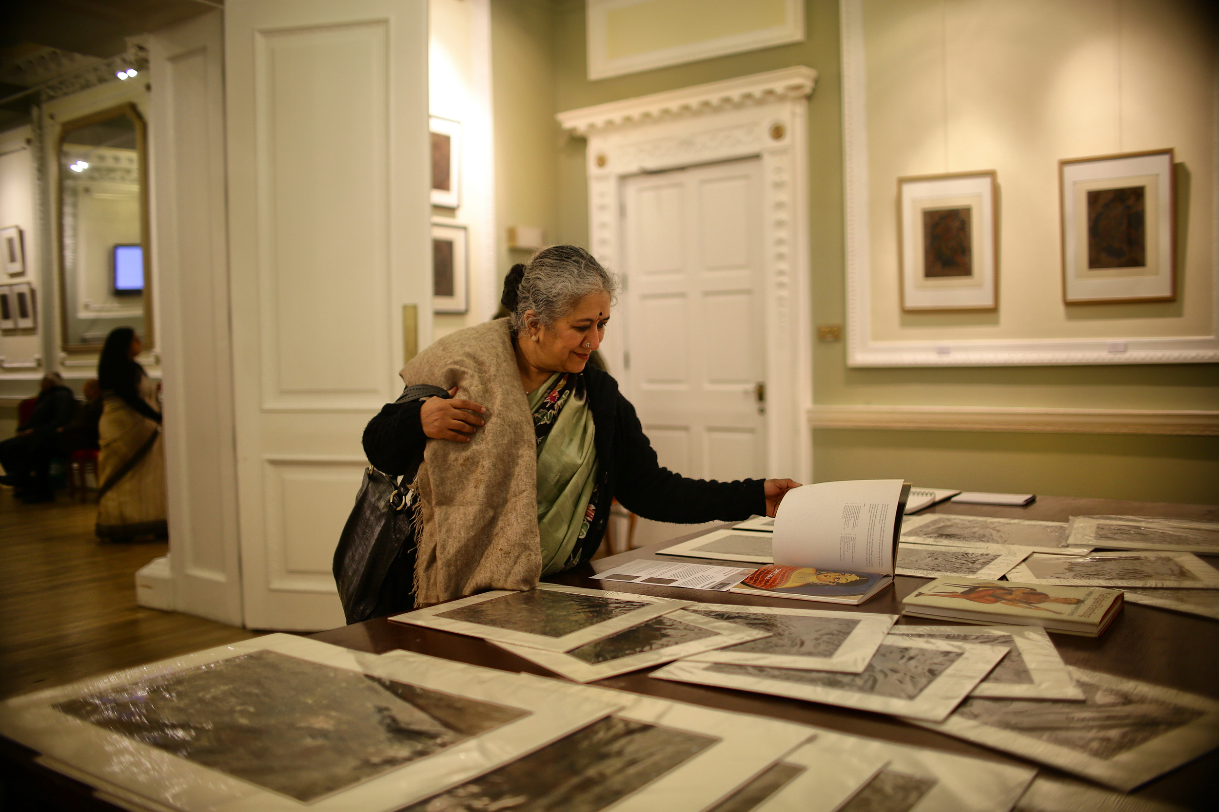 Guests having a look at books on Kalighat patachitra, Nehru Centre London, 14/09/2015.