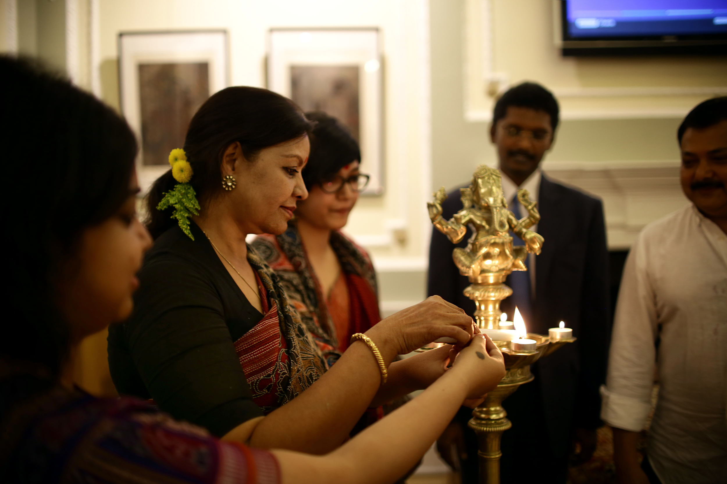 Sangeeta Datta lighting the lamp at the inauguration ceremony of the exhibition, Nehru Centre, London, 14/09/2015.