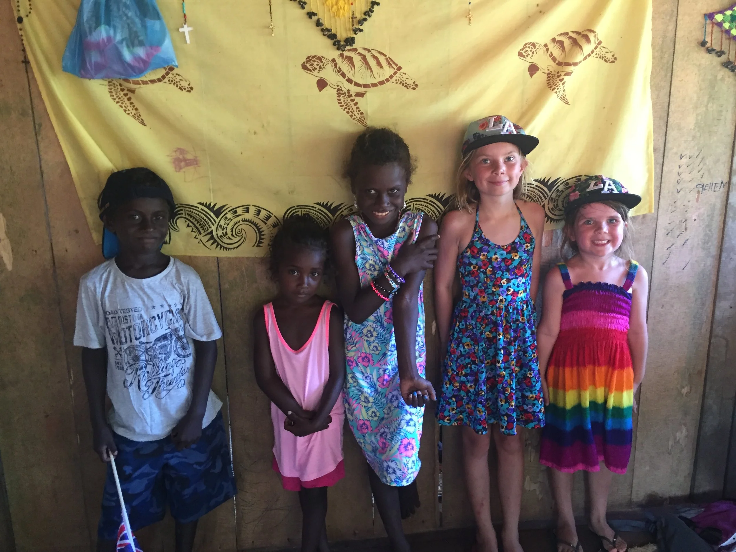 Charlotte and Lola playing with the local kids