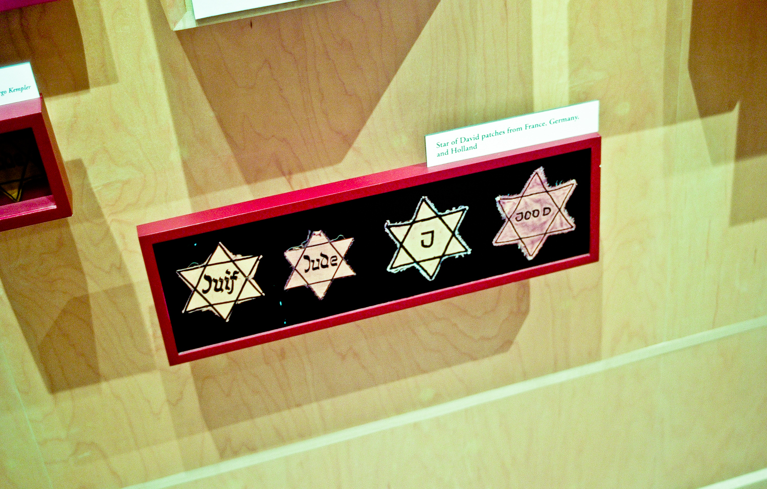 Various versions of the Star of David that was required to be worn by all Jews.