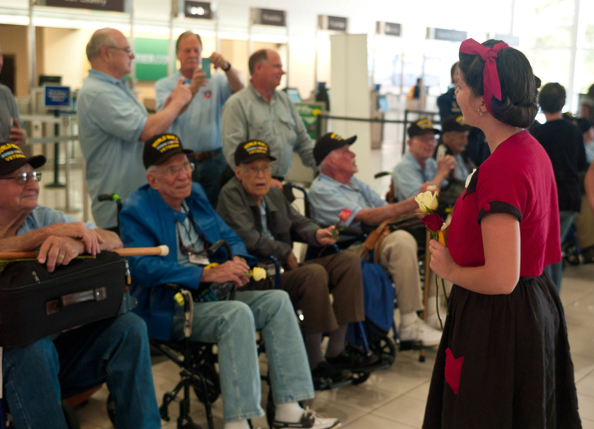 Faith had the wonderful opportunity to go down the line of veterans singing their favorite songs while they waited for the bus to take them to their hotel. 