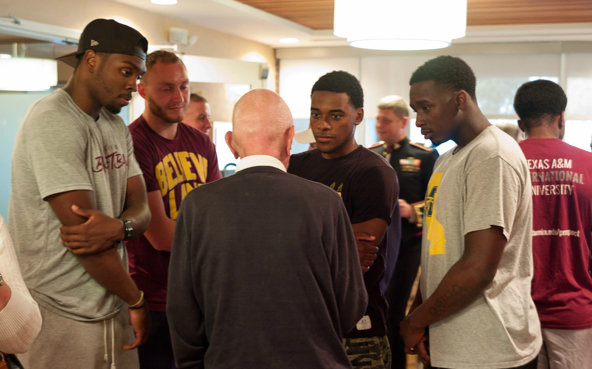Jerry Yellin, P51 pilot, telling stories to a few fellows from the basketball team that was staying at our hotel. 