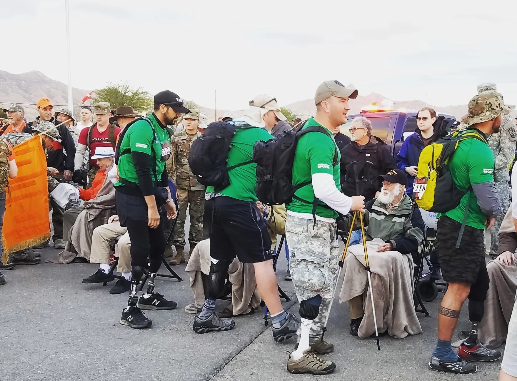 wounded warriors shake the hands of bataan survivors moments before they head out to the grueling New mexico desert