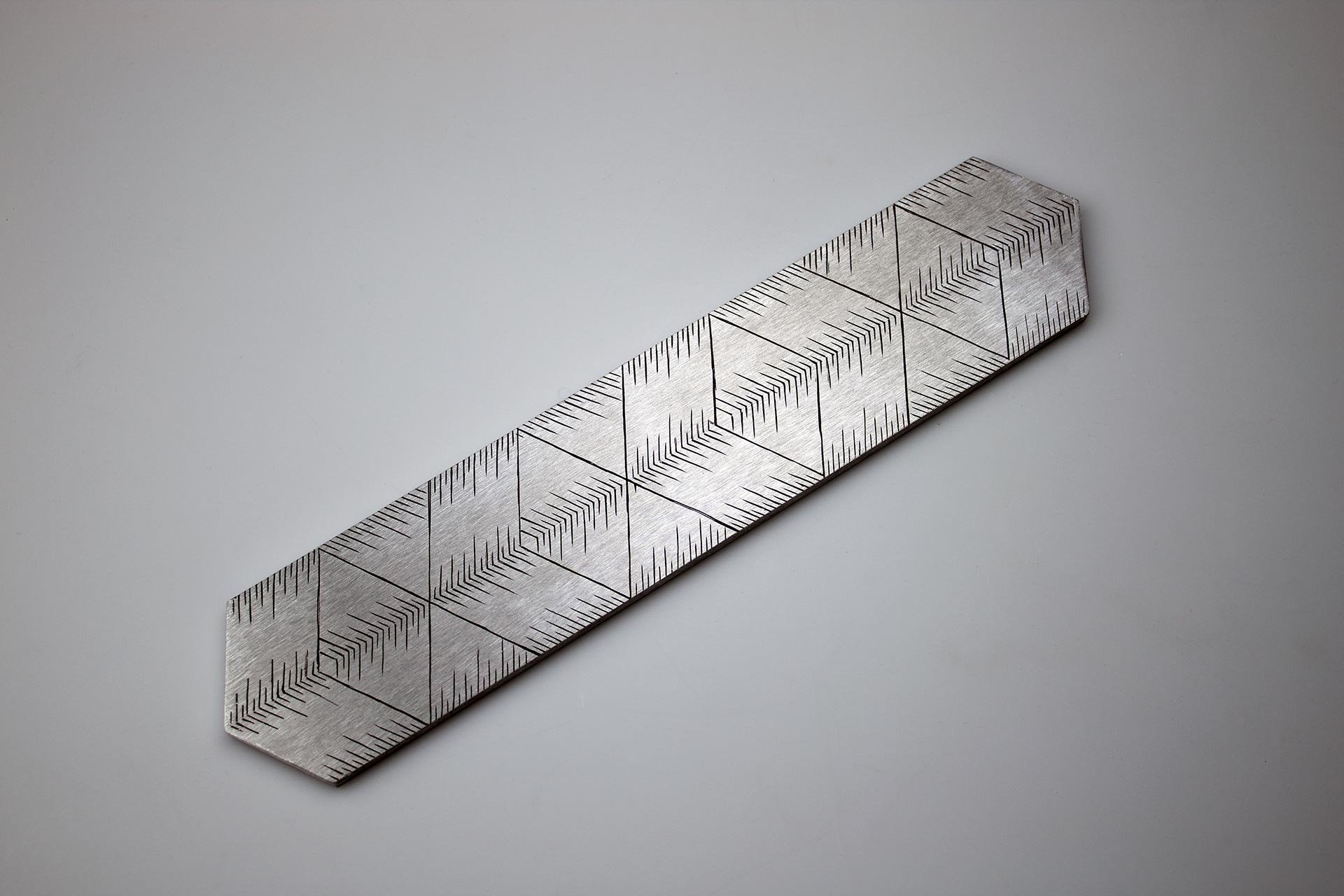 Instrument #46, hand engraved aluminum and ink. 9.625” x 2” x .25"