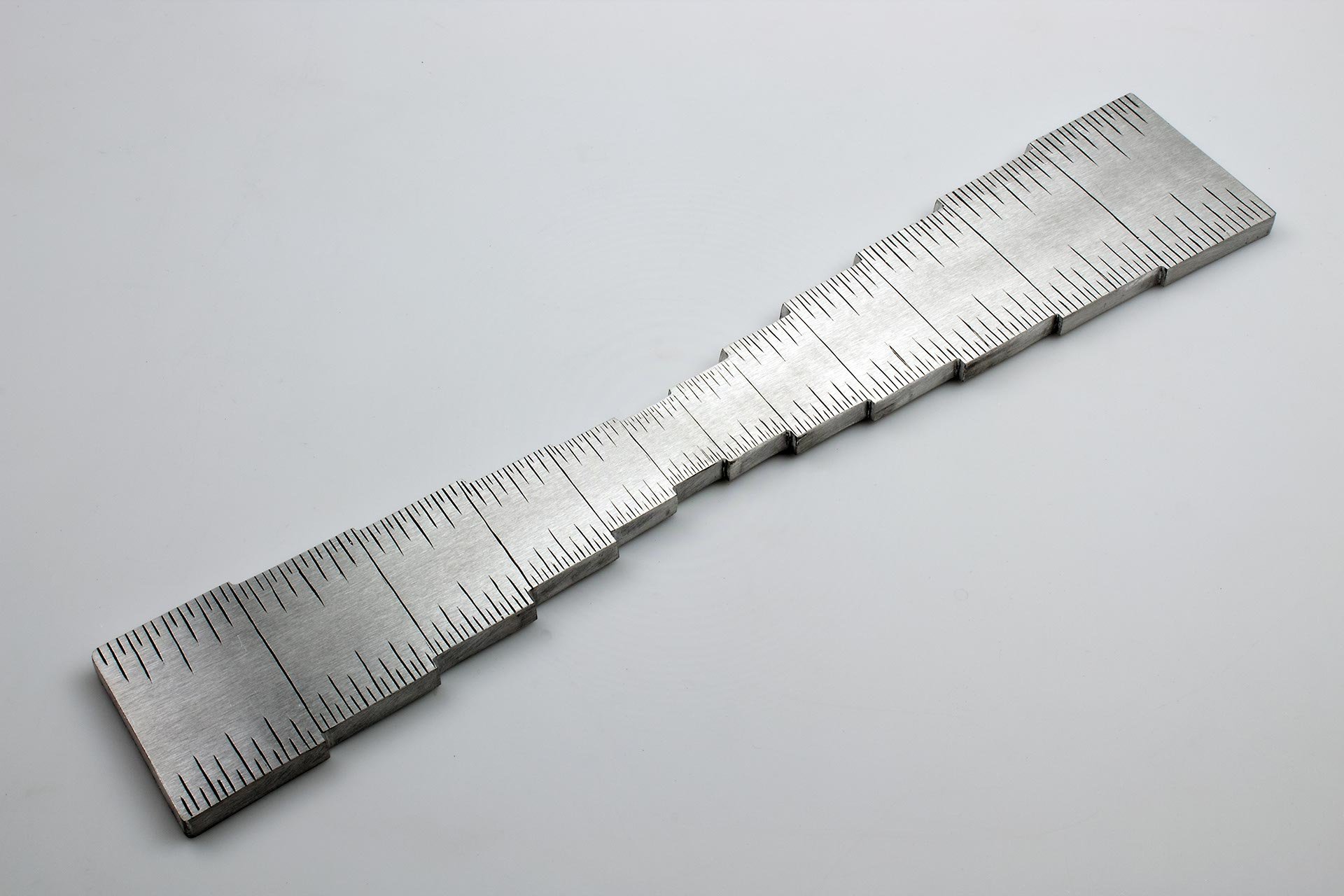 Instrument #13, 11.875" x 2.75" x .25, hand engraved aluminum and ink.