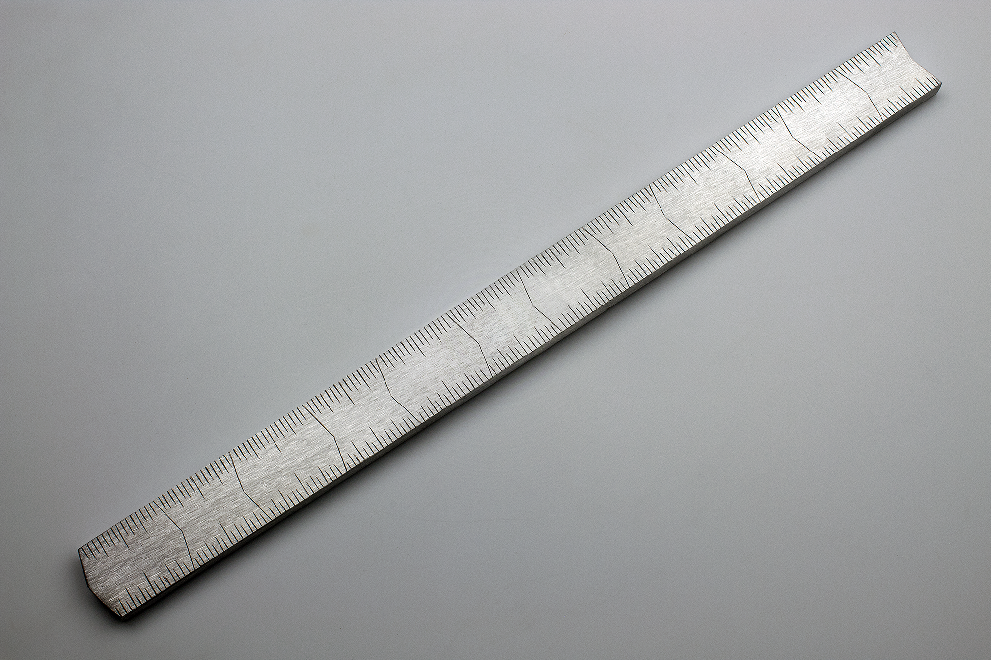 Instrument #9, 0.25" x 1" x 12.25", hand engraved aluminum and ink.