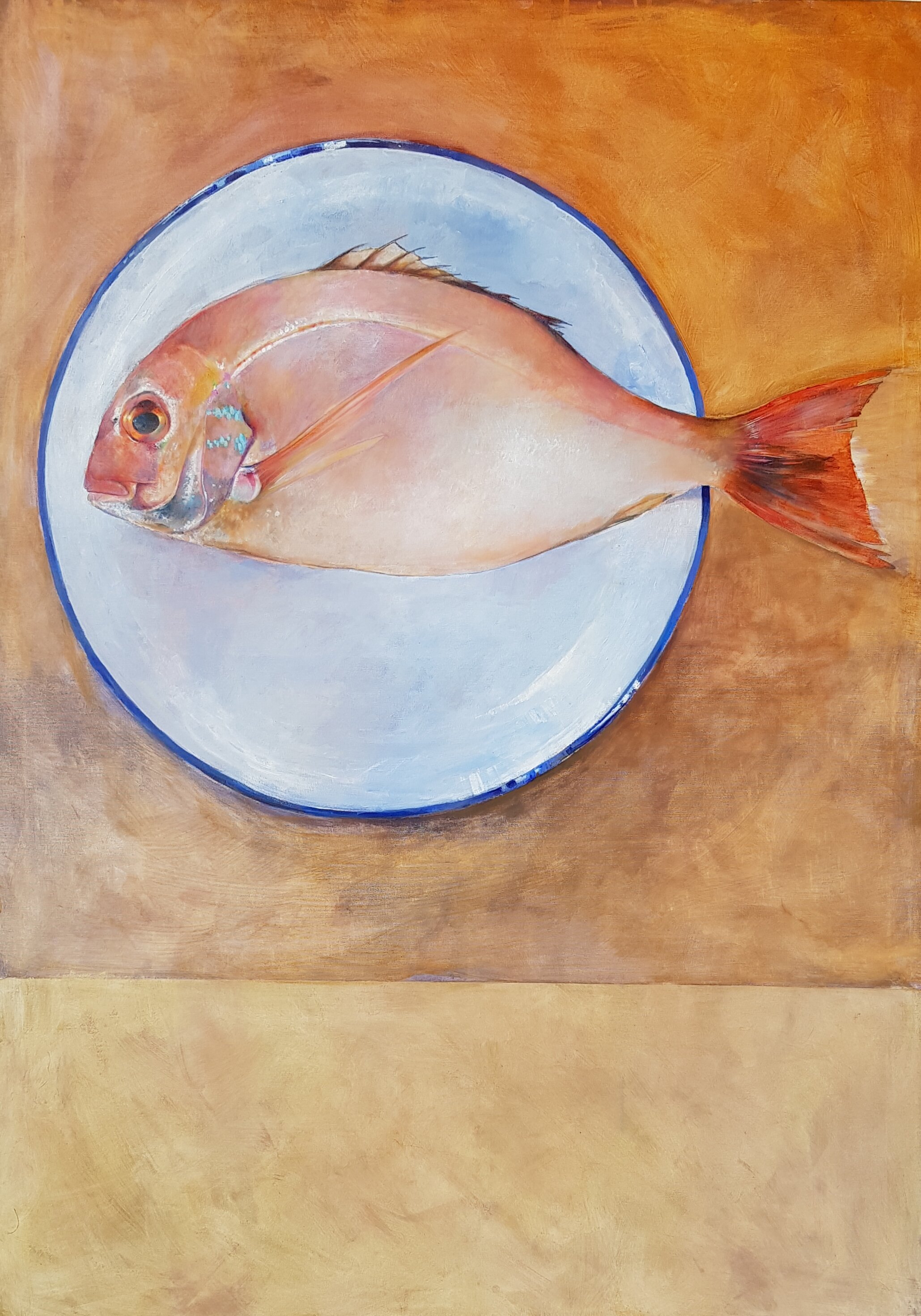 Seabream on an enamel plate with blue band