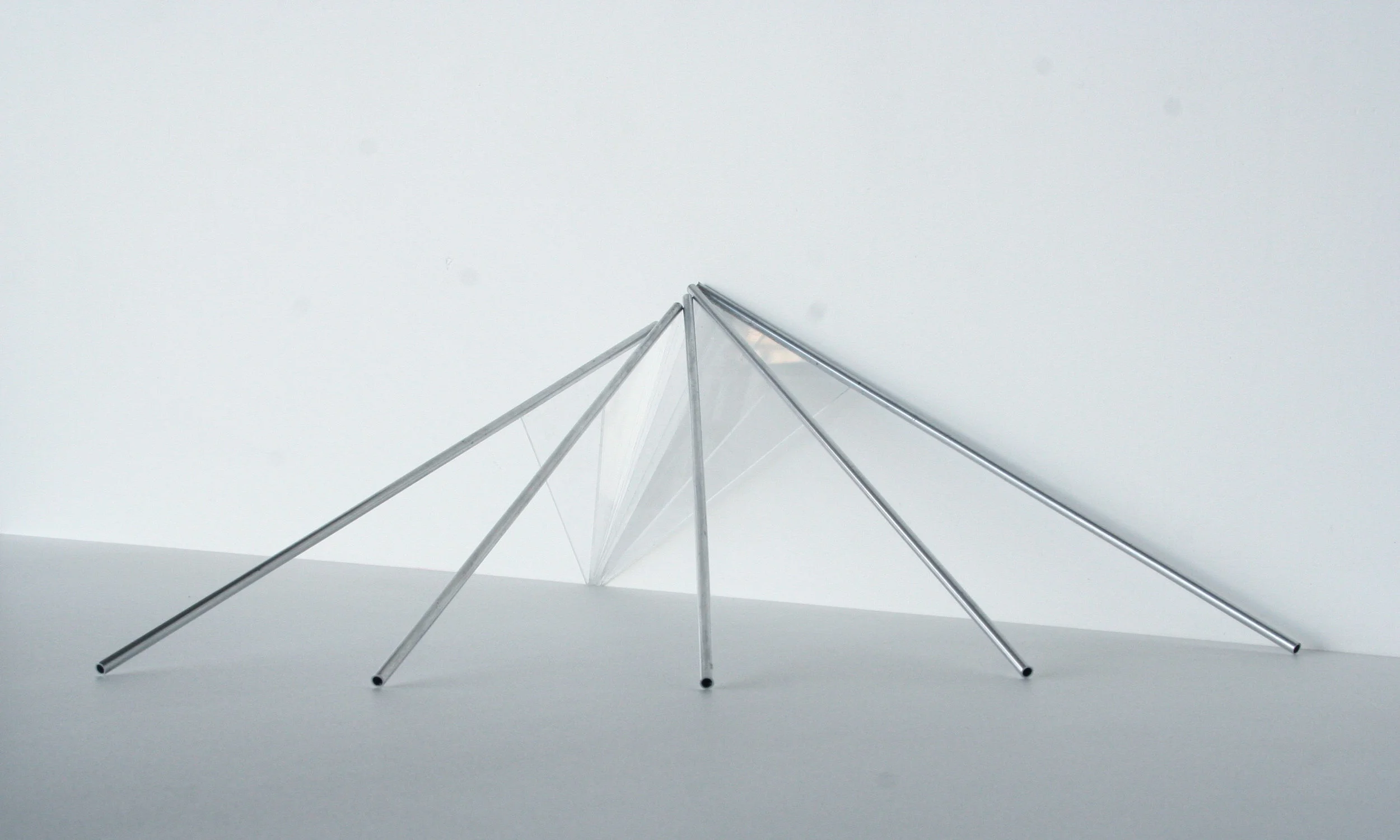 Untitled , 2010, five glass triangles attached to metal tubes. Each approximately eight feet long. Proposal from series Action at a Distance . Example of one possible arrangement.