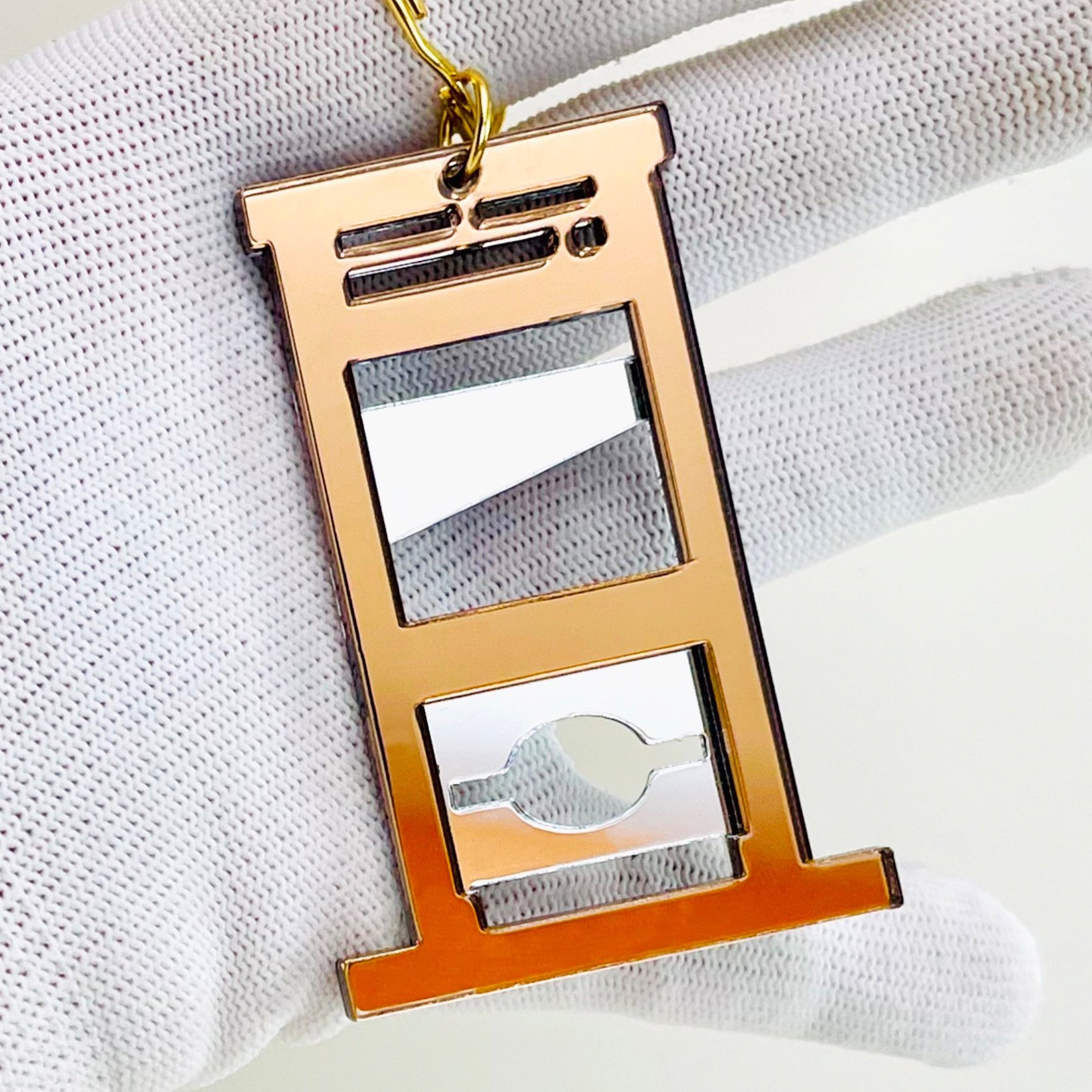 Mirror Guillotine Charm