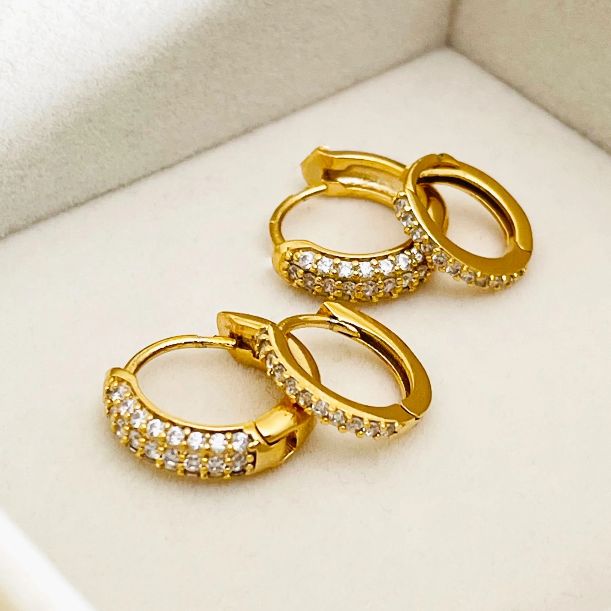 All over Crystal Huggie Hoops