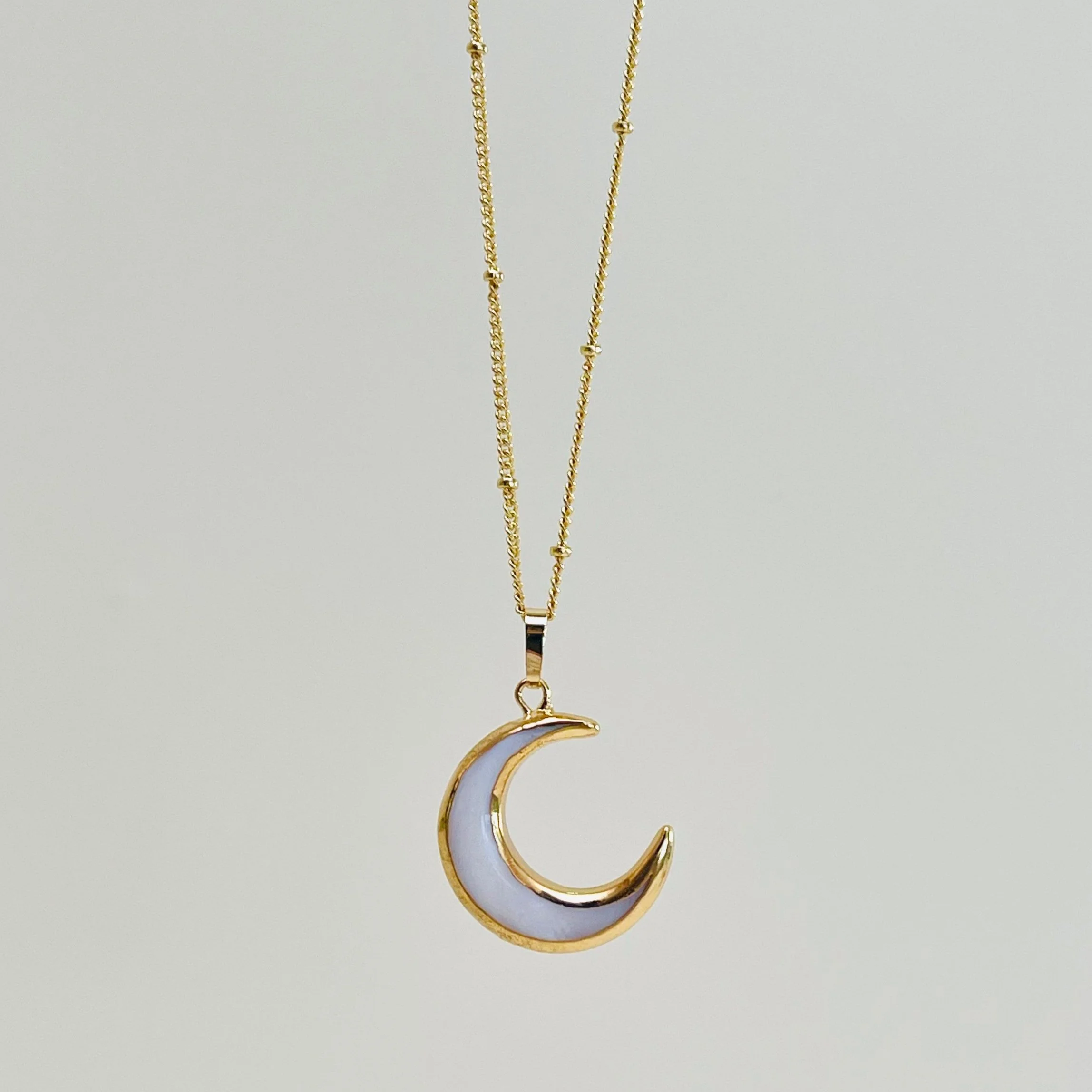 Carved Mother of Pearl Crescent Moon Pendant
