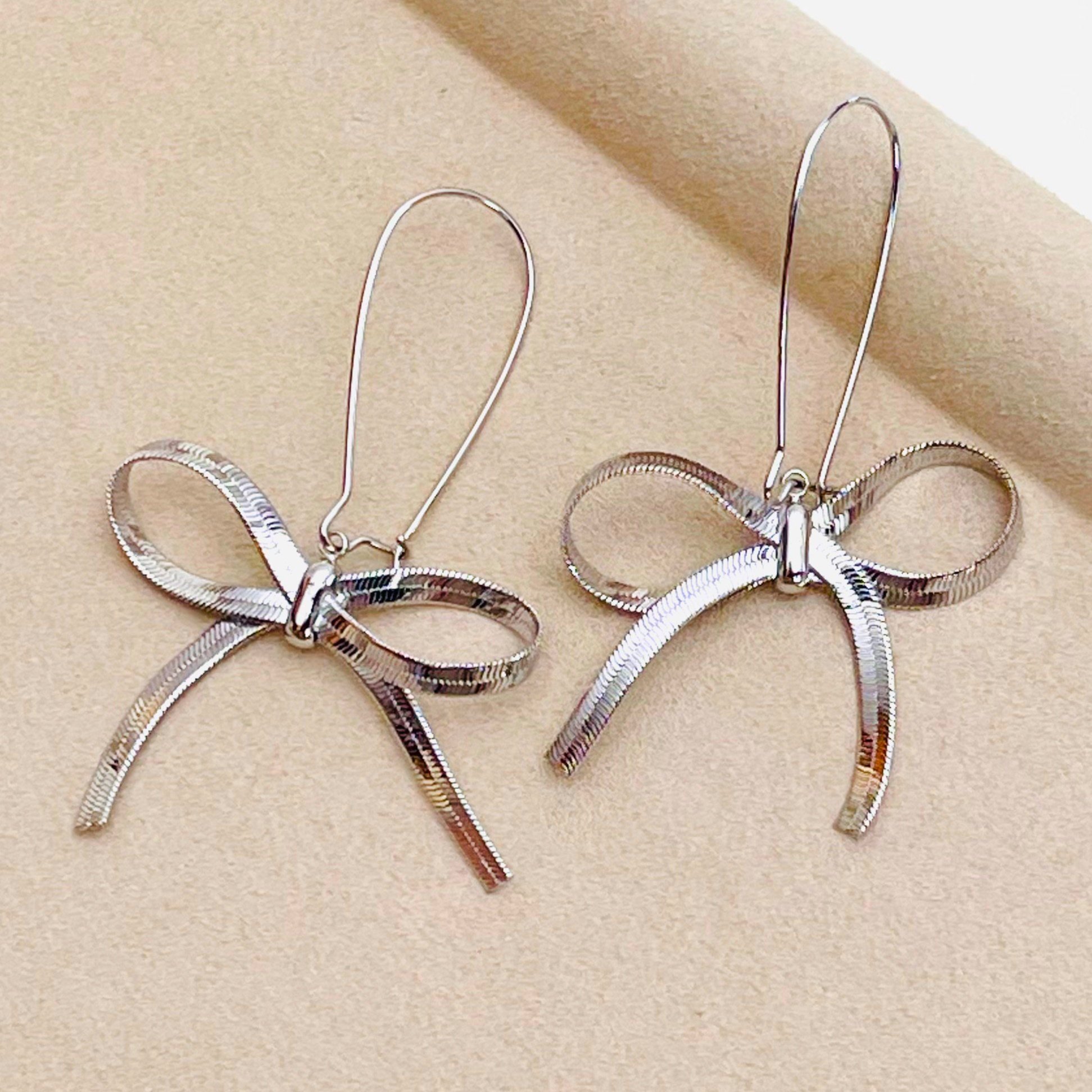 Silver Bow Long Drop Earrings