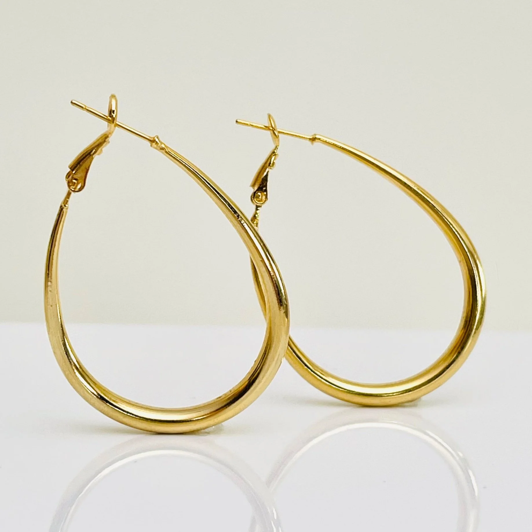 The Golden Oval Drop Hoops