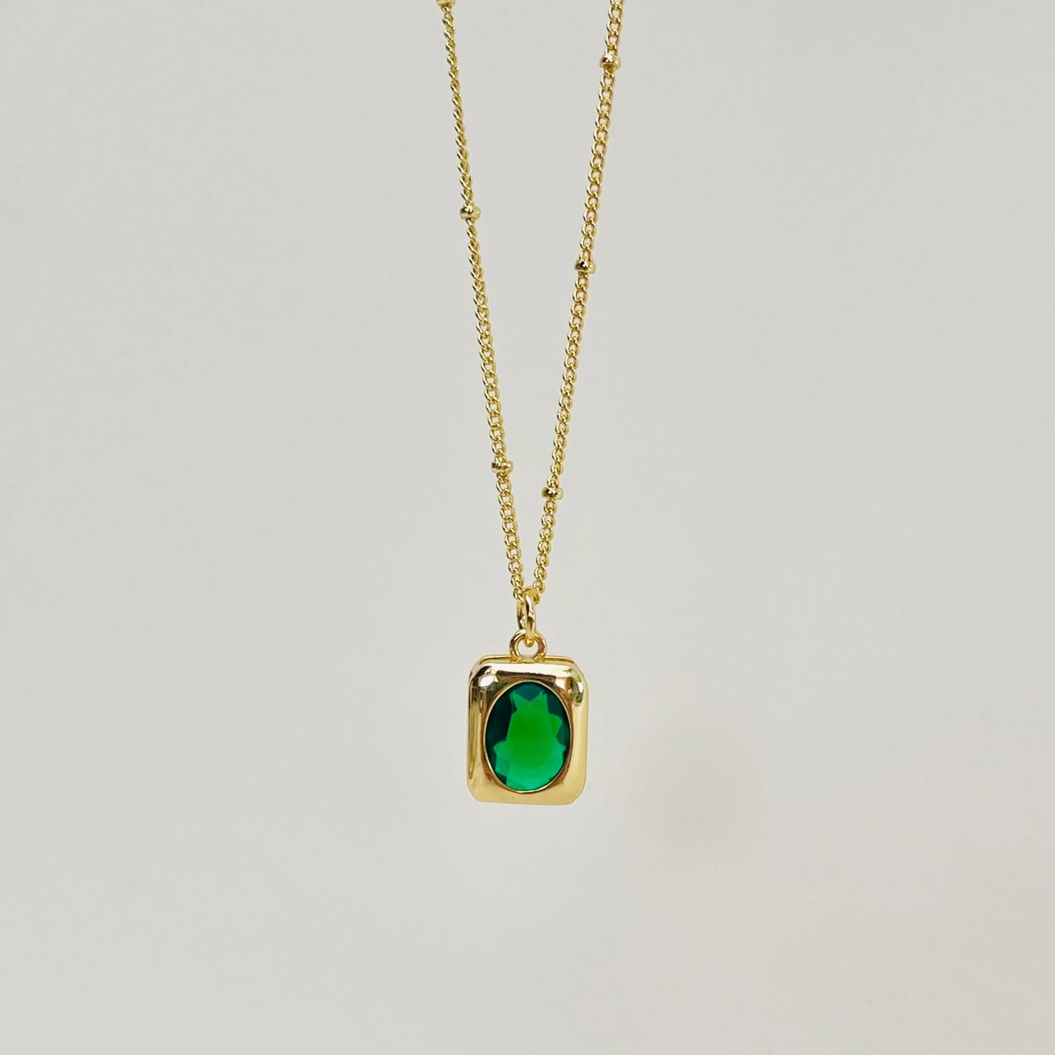 Emerald Crystal Crest Pendant