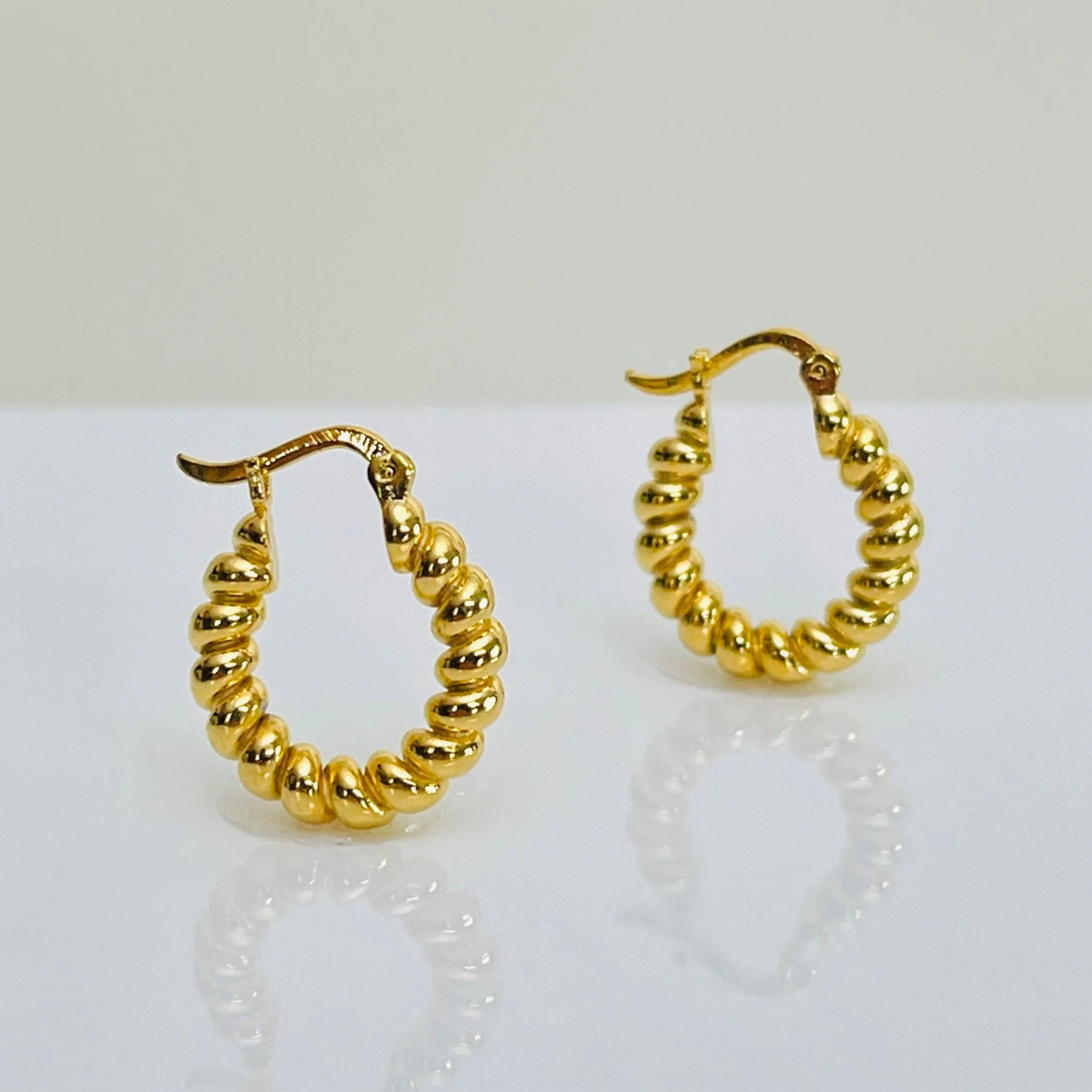The Braided Twist Golden Huggie Hoops