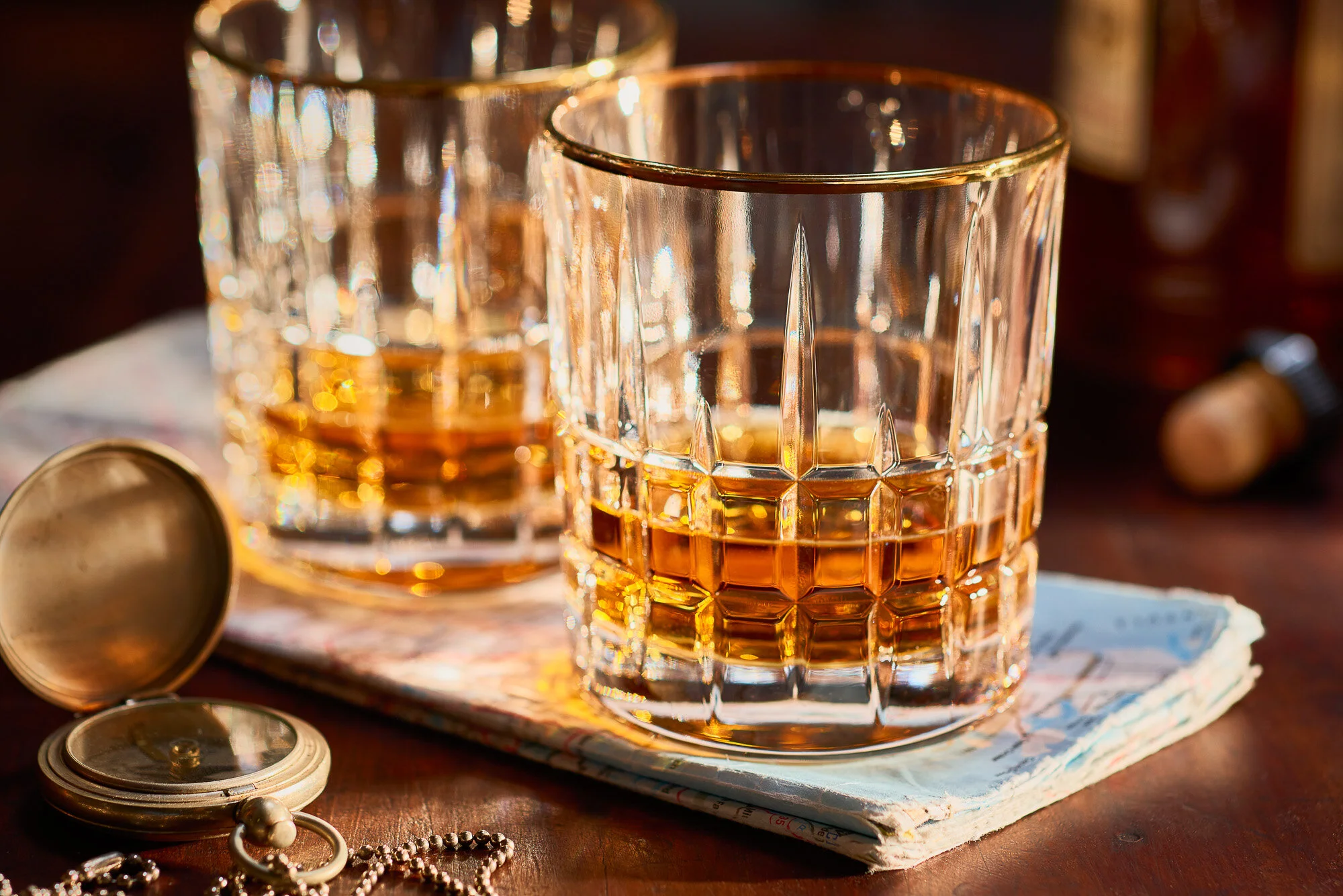 Glasses of Whiskey with Map and Compass by Jeff Wasserman