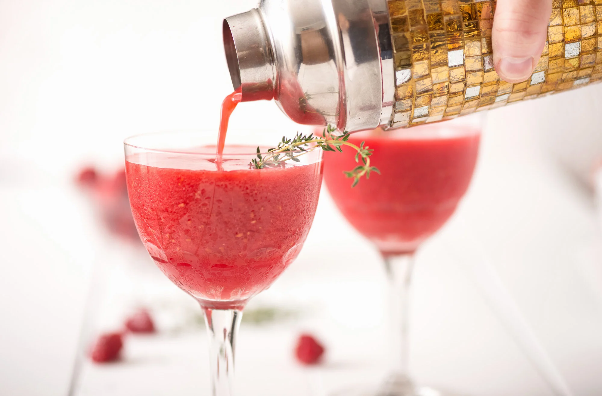 Pouring Red Cocktail in Toronto Food Studio 