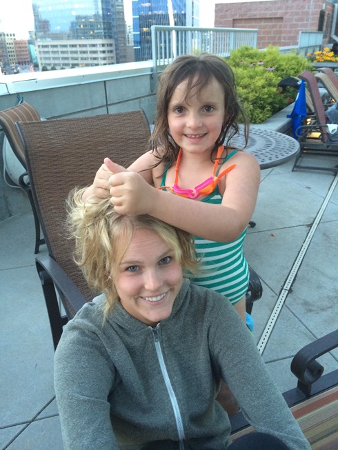 Elle styling Marisa's hair
