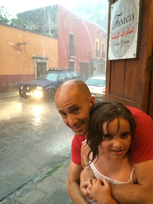 The kids were nervous, but we just laughed and had fun with it. Notice the spouts pouring water that has collected on the roof.