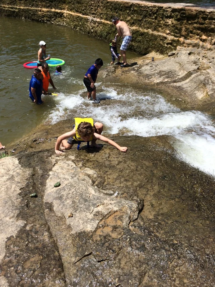 Fearless Tag climbing up the slippery limestone
