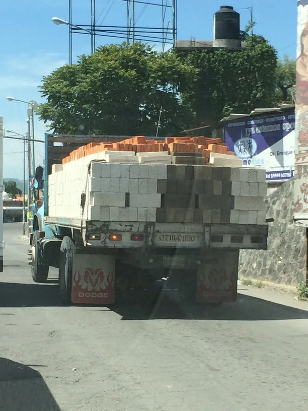 The bricks on top are held on by gravity