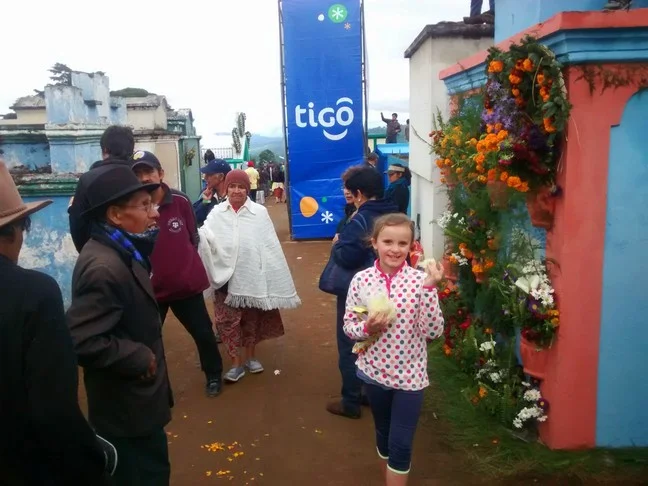 Elle is always happy with cotton candy in her hands! Love the decorated grave marker and erected advertisement for Tigo, a local cell phone company. 