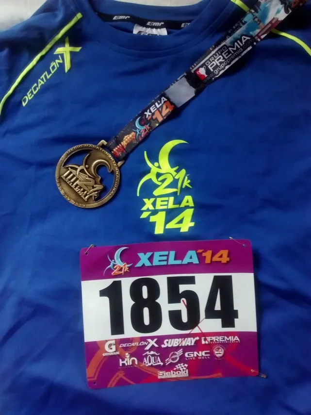 My tech shirt, bib and finishers medal.