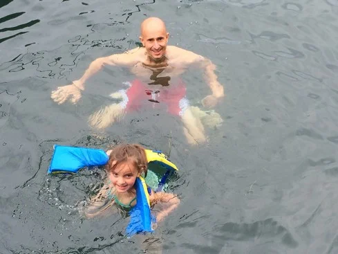 Elle thought it would be funny to wear Tag's life jacket.