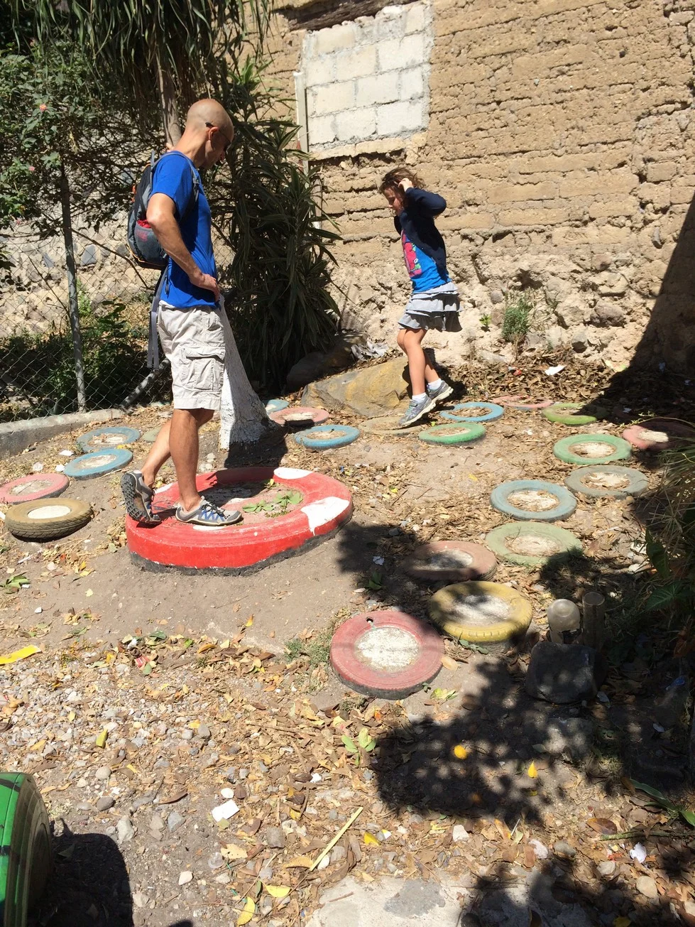 Used tires, painted, filled with cement and buried makes for some creative games in a park