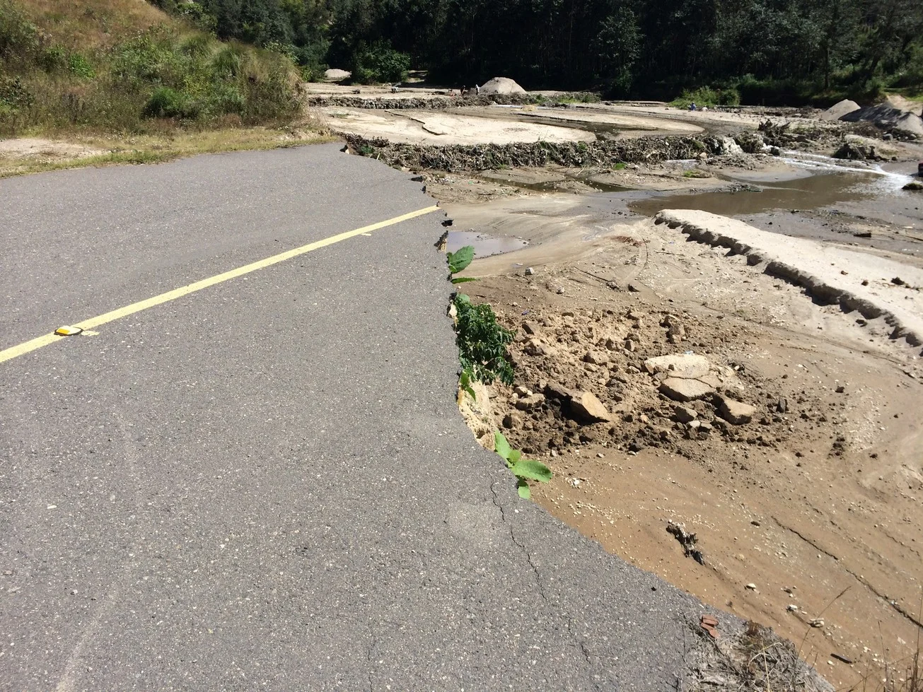 the end of the what used to be a bridge over the river. 