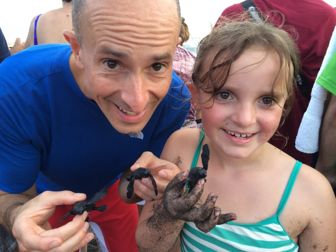 Elle and I holding newly hatched Leatherback Sea turtles. She was thrilled.