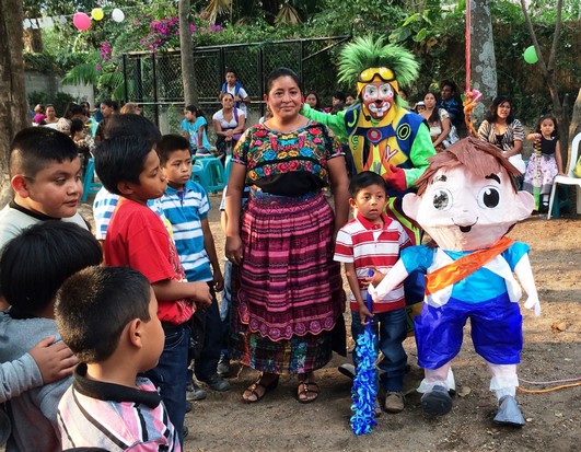 Estella and Abdul had their picture taken with each pinata before Abdul hammered it for at least a minute. Other kids got to hit the pinata after Abdul. 