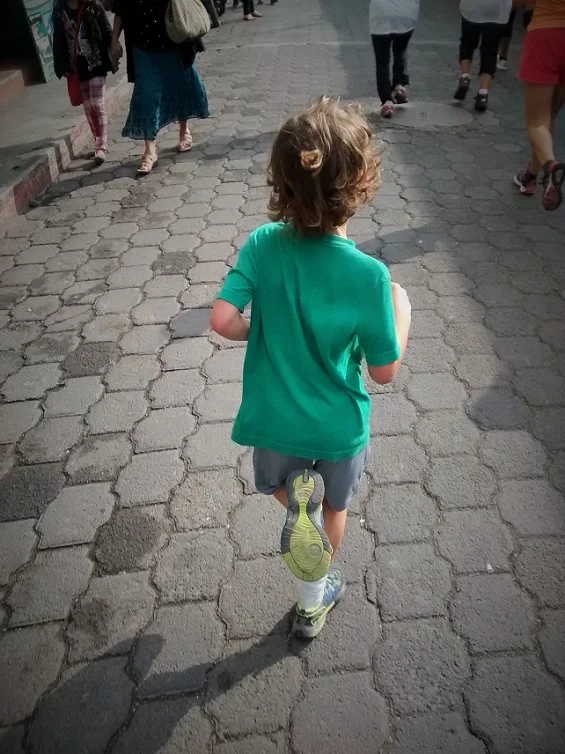 Tag in mid stride at full speed.