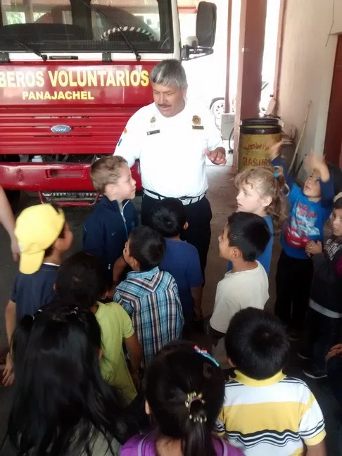 The Chief of the Panajachel Bomberos welcoming students from the LIFE School.