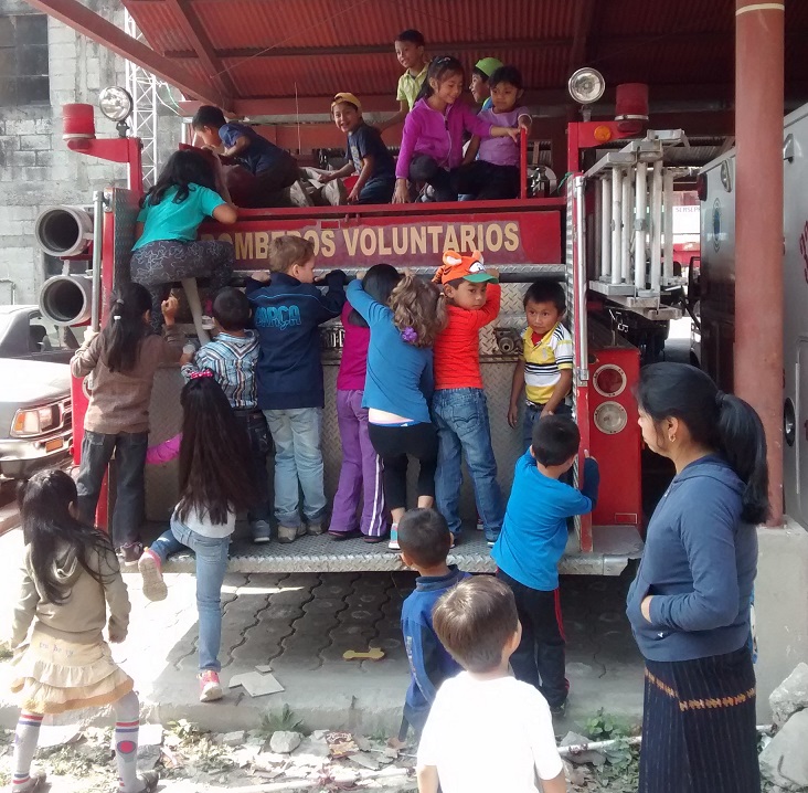 Dogpile on the firetruck. Who needs a jungle gym?