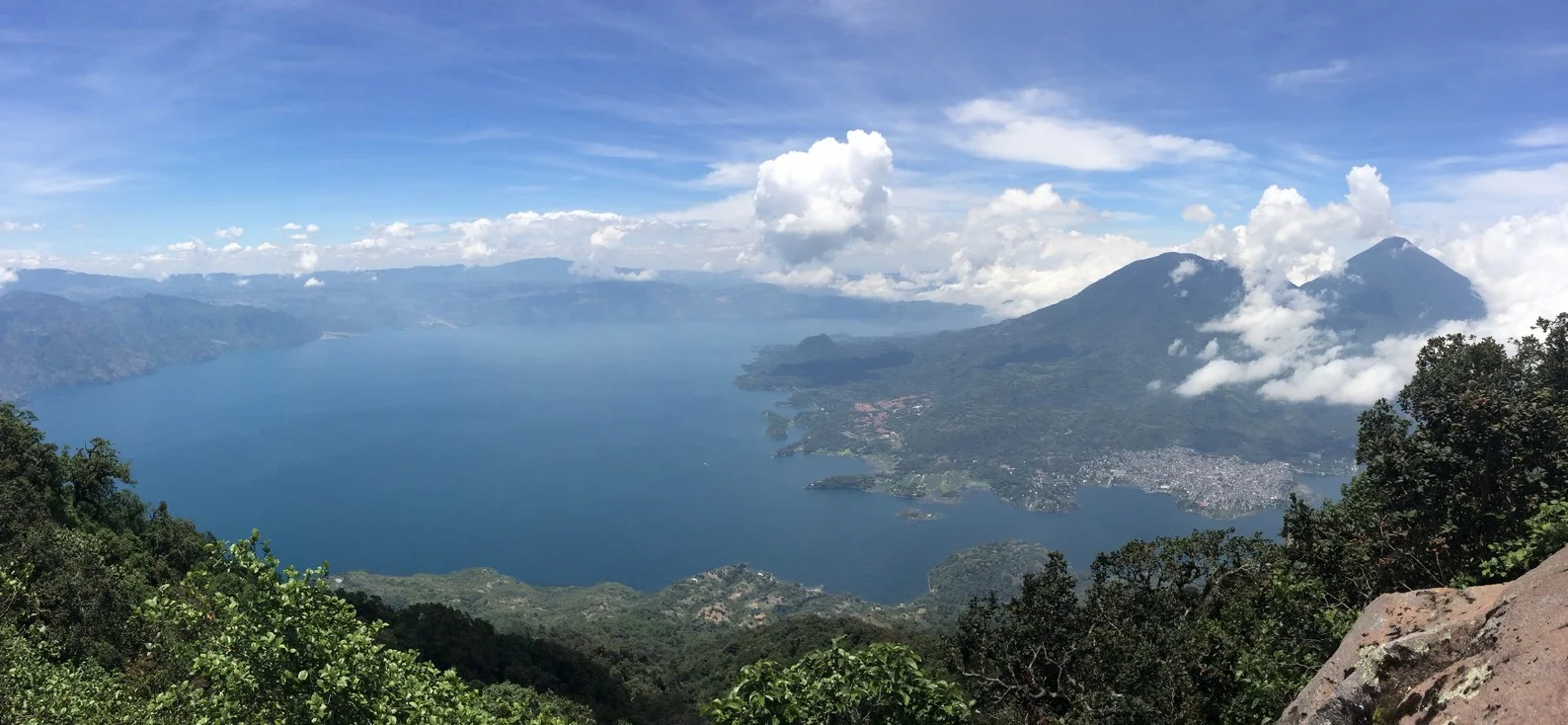 Panoramic view of Lake Atitlan with Tolimán and Atitlán Volcanoes on the right.
