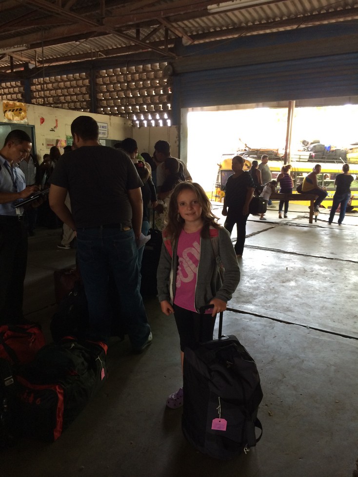 Customs in Nicaragua - Ela is in charge of her backpack and the bag on wheels. I was responsible for the 2 large bags, my backpack, the food bag and the pillow. Look at the bus we didn't take (background). I'm not sure our bags would fit anyway.