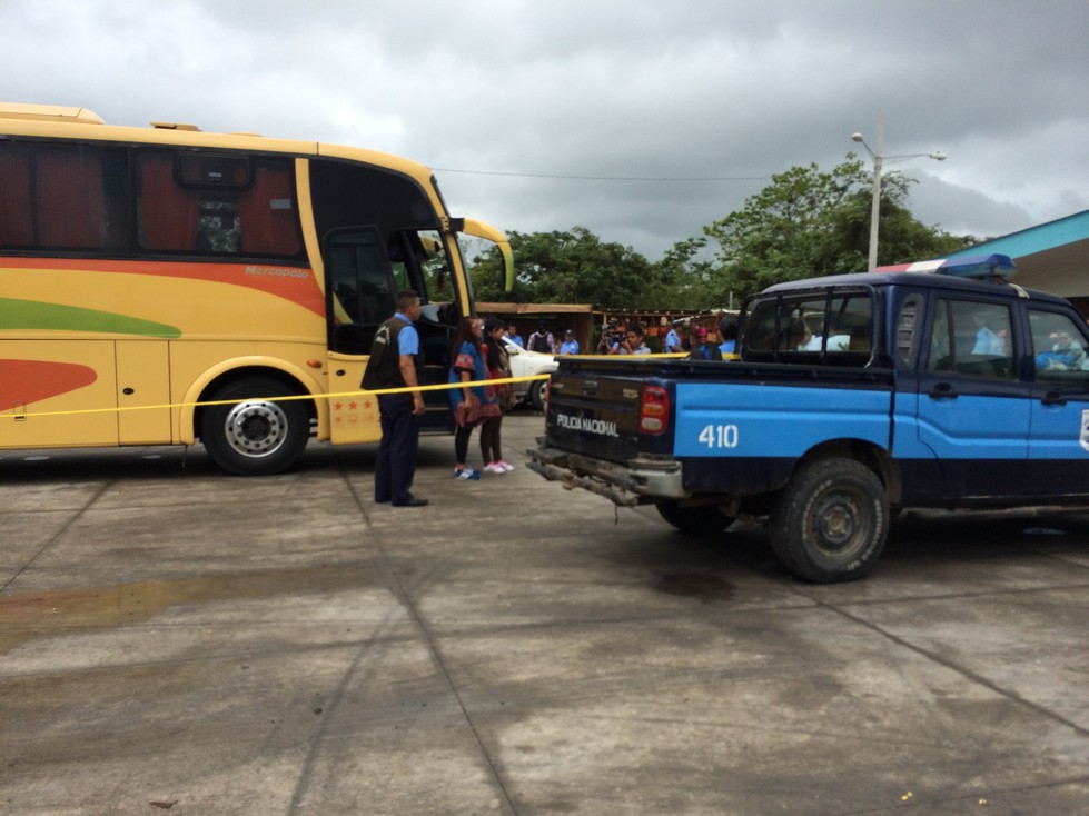 Look closely - These two girls standing in front of the bus doors were caught transporting cocaine across the border into Nicaragua. Apparently, the cocaine is strapped around their middles and covered by the big shirts.