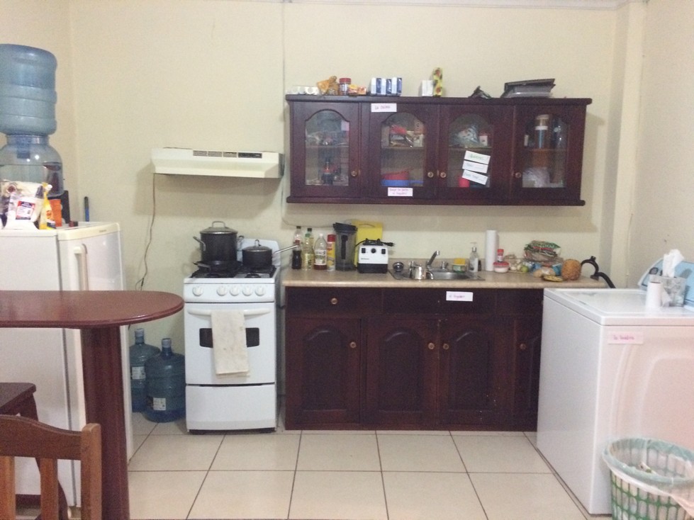 It's not a beautiful kitchen, but it works and we're not sharing it with anyone else! You can see Ken's office on the left, and that is a washing machine on the right. The washing machine leaks, and we prefer to send our laundry out once a week. Notice the white notecards throughout the apartment. These are my way of helping all of us learn Spanish! The kitchen also came with a microwave, but we moved it to the floor on the other side of the refrigerator. We simply don't use a microwave anymore.