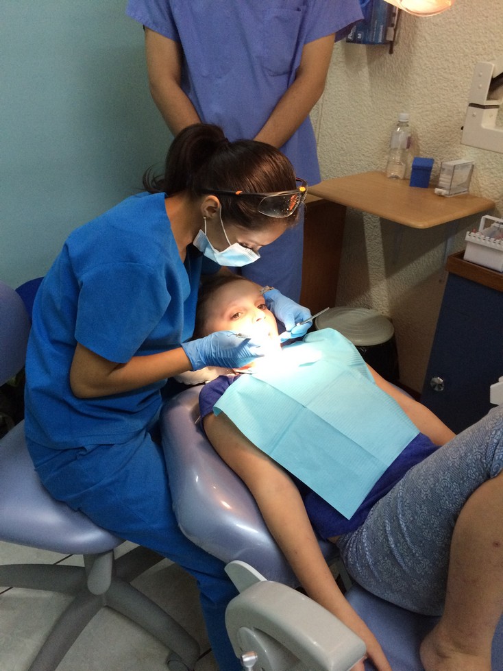 The hygienist is wearing a mask and gloves. That is good. But, shouldn't Elle be wearing protective eyewear? This was given to her later. 