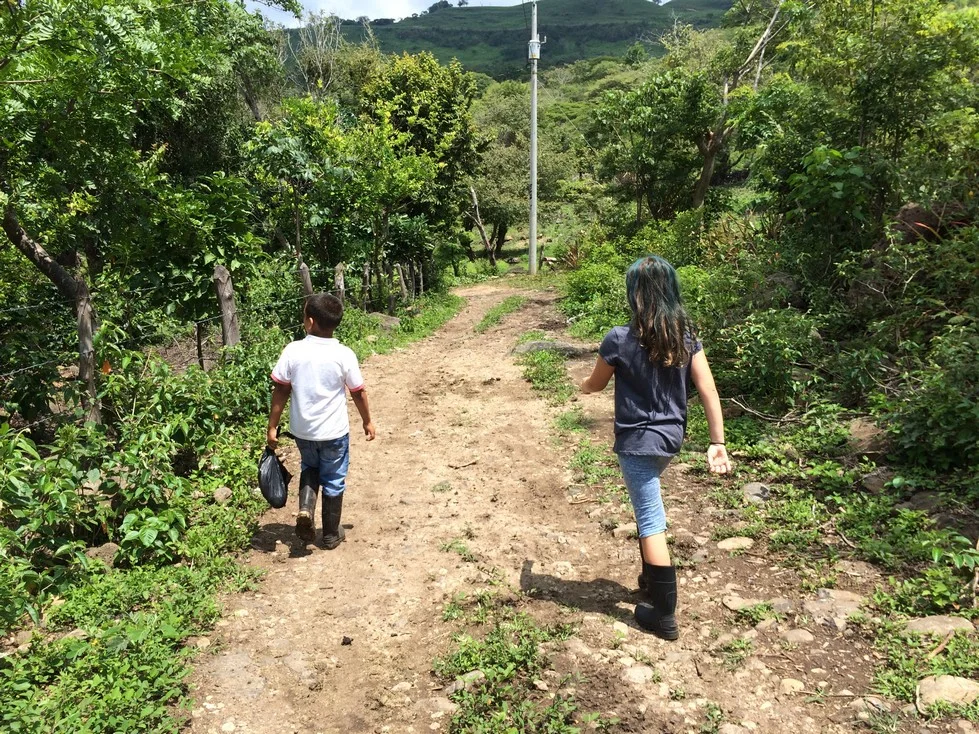 This is one of my favorite pictures of Ela. She was so happy this entire weekend. She loved walking in the fields, playing with the kids and enjoying a "real life Social Studies lesson". This is what life is like for many Nicaraguan families. 