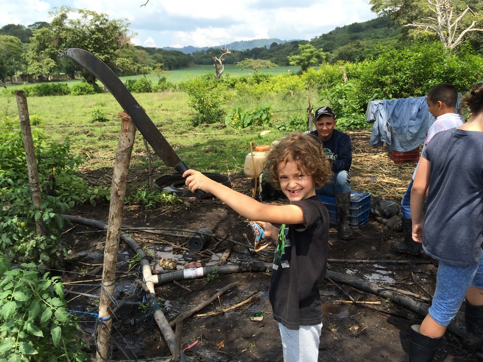 Of course Tag was drawn to Juan's brother's machete. This child has a knack for finding weapons. 