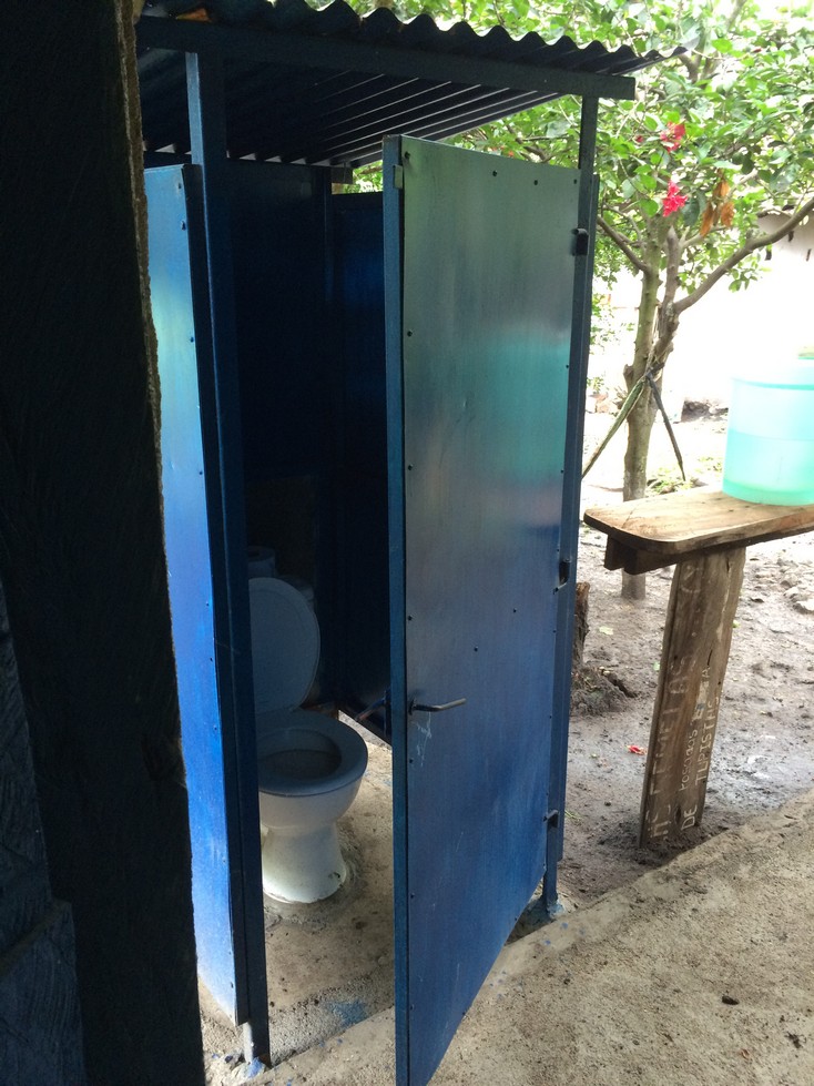 This was our private bathroom. The family's bathroom is similar. Notice the container of water on the table at the right. This is what we used to wash our hands. 
