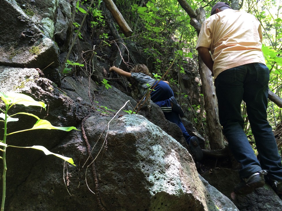 The climb down, and later back up, the waterfall was steep. Tag is literally pulling himself up over the rocks. 