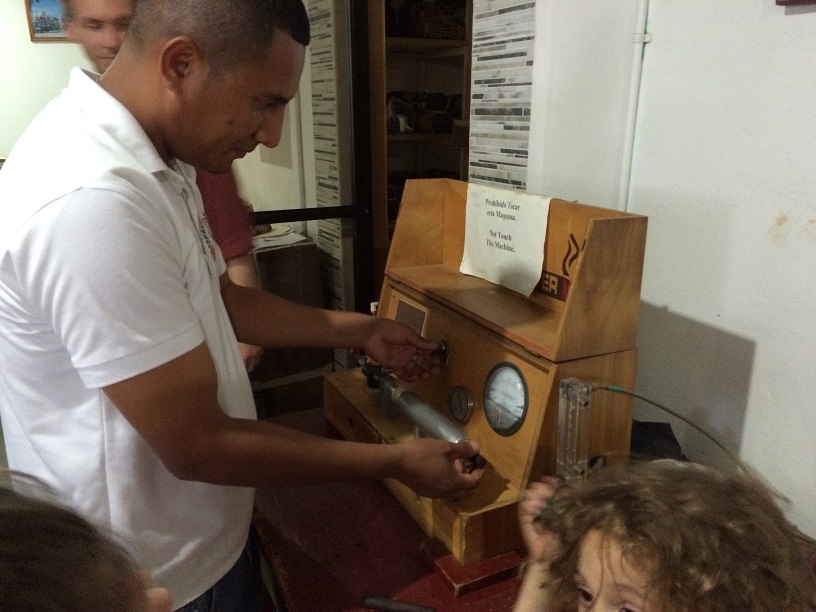 This machine measures the density of a cigar. Cigars that are packed too tight or have a tight spot will be rejected and the pair that made them will not get paid for it. The rejected cigar will then be used in the makings of cheaper cigars. 